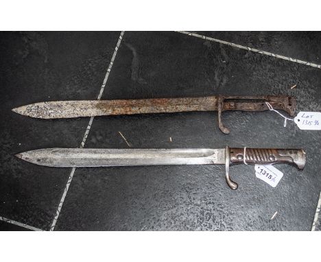 German Model 1898/05 Bayonet, with saw back removed.  No scabbard, together with one other.
