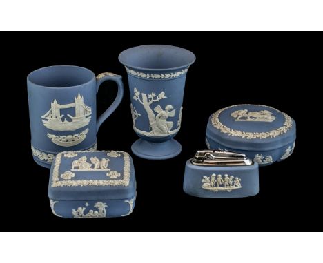 Collection of Blue Wedgewood Jasperware 5 pieces in total to include, two trinket lidded boxes, vase, table lighter and cup. 