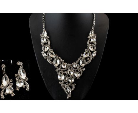 White Crystal Statement Necklace and Earrings Set, an articulated Y shaped necklace of elegant scrolling design, set with bri