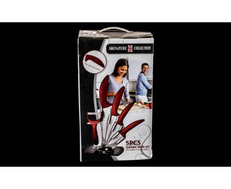 Brand New Boxed Signature Collection 5 Piece Ceramic Knife Set, with peeler, on acrylic stand. Red colourway.