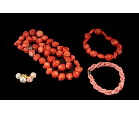 Collection of Coral Jewellery comprising a red coral necklace, a pink coral bracelet and a pair of pink and pearl cufflinks.