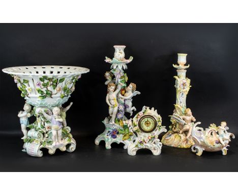 A Collection of Five Pieces of Dresden Porcelain, to include a figural cherub candlestick with applied floral decoration, one