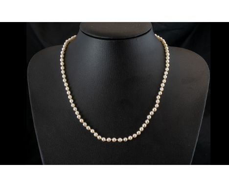 A Single Strand 16 inch Pearl Necklace with 9ct gold clasp. 