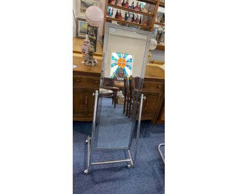 An Art Deco Style Retro Chrome Cheval Mirror, on stand, of rectangular form.  Overall height 57", width 20".