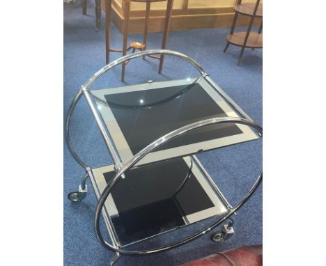 Chrome Art Deco Style Drinks Trolley, atomic shape on caster feet, with two mirrored glass shelves.  