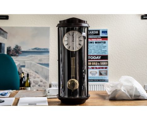 Reproduction Mahogany Quartz Wall Clock, measures 24'' tall x 10'' wide approx.