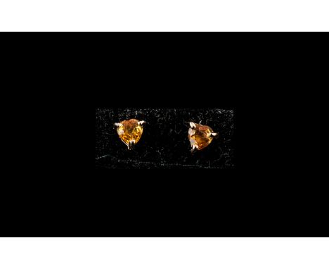 Orange Sapphire Stud Earrings, solitaire orange sapphires, trillion cut with the hint of a heart shape, set in rose gold verm
