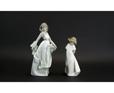 Two Nao Figures, comprising: a young lady with a shawl, 10'' tall; and a figure of a young child 8'' tall. Both in good condi