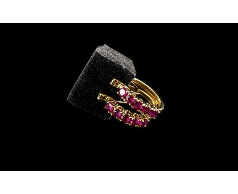 Ruby Hoop Earrings, five round cut rubies of a beautifully rich red, closely set down the front of each hoop, an overall tota