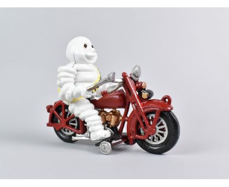 A Reproduction Cold Painted Cast Iron Advertising Figure, Michelin Man on Motorcycle, 22cm Long