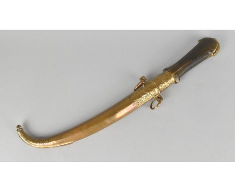 A North African Wooden Handled Curved Blade Dagger with Brass Scabbard