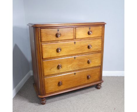 A Victorian mahogany Chest of Drawers, of two short and four long graduating drawers with decorative tunerd handles inset wit