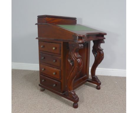 A Victorian style reproduction Davenport desk, with sloped front, and four side drawers on each side and carved cabriole supp