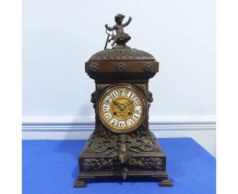 A French bronzed-metal Mantel Clock, late 19th century, the architectural case surmounted with an chrub and decorated with ma