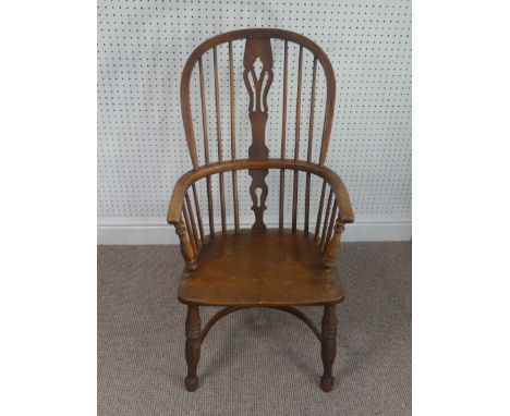 A Late Victorian ash and elm Windsor Chair, stick-back with pierced splat above solid carved base upon turned legs and crinol