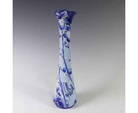 A Moorcroft Macintyre Florianware Vase, with flared rim, repaired, and inverted stem, of light blue ground with tubelined flo