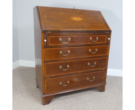 An Edwardian mahogany shell inlaid bureau, of a small size, the fall front, opening to reveal a fitted interior, over pull-ou