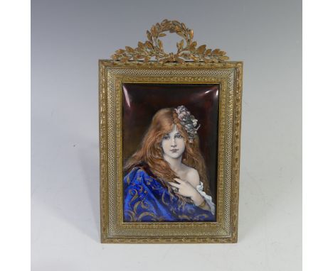 An early 20th century Limoges enamel Plaque, of convex rectangular form, painted in polychrome enamels with head and shoulder