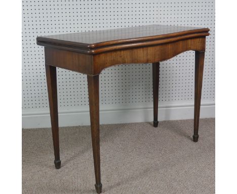 A Victorian mahogany serpentine fold over Card Table,&nbsp;on square tapering legs, signs of woodworm on pull-out and top wor