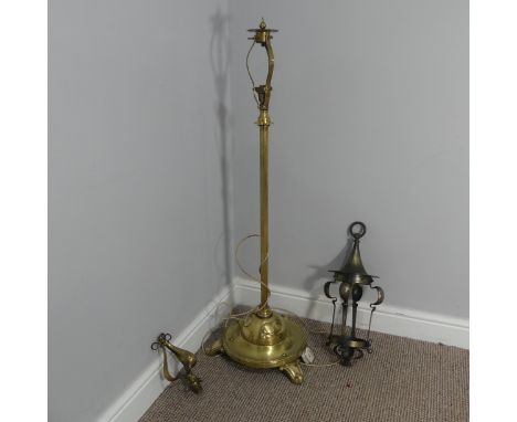 An Arts &amp; Crafts adjustable brass Floor Lamp with three raised hearts to the base supported by three extending scroll fee