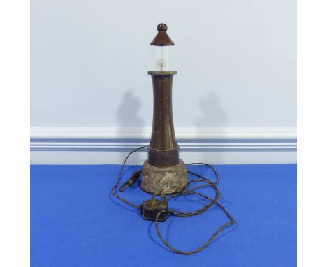 A contemporary Cornish serpentine lighthouse lamp, with mostly polished surface to naturalistic form base, W 12 cm x H 38 cm 