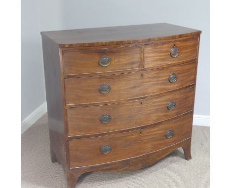 A Georgian mahogany bow-front chest of drawers, with two short drawers and three long drawers, decorated with metal handles r