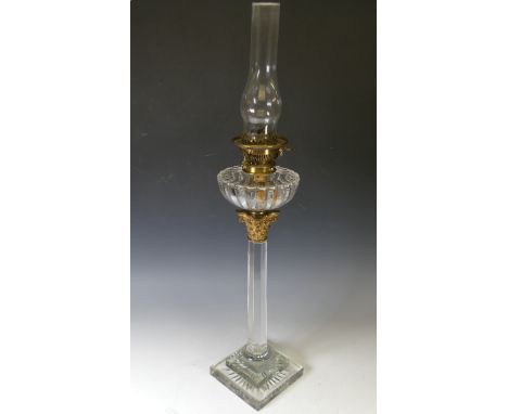 An unusual 19thC clear cut glass oil lamp, in the form of a Corinthian column, with brass capital and 'Hinks &amp; son' paten