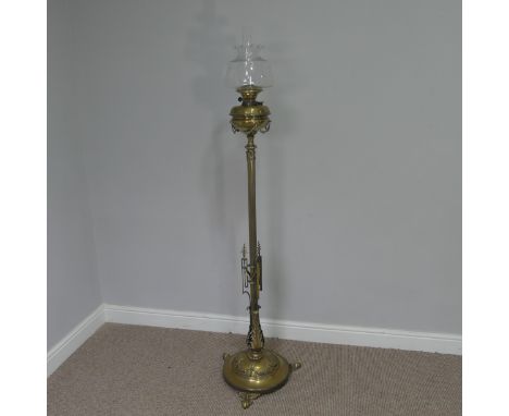 A Late 19thC/Early 20thC Brass standard Oil Lamp, with decorative reeded column, brass font and decorative finish, W 46 cm x 