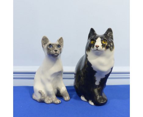 A pair of Winstanley pottery Cat Figures sitting, both with glass eyes and signed bases, H 29 cm. 