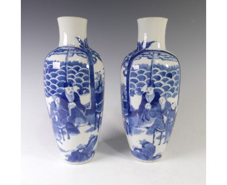 A pair of antique Chinese blue and white Vases, of slim baluster shapes, with underglaze blue depictions of figures, necks re