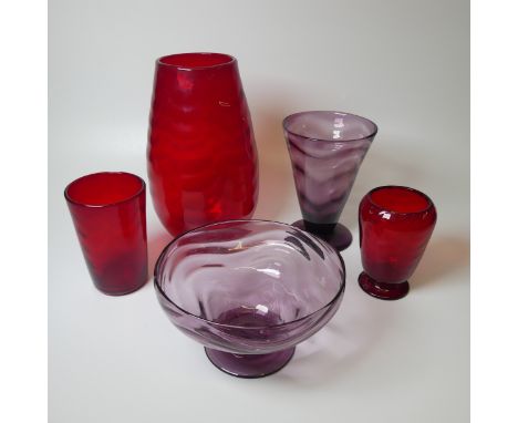 A large Whitefriars wavy Vase, in ruby red, together with another wavy Vase in ruby red, designed by William Wilson, a taperi