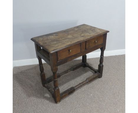 An 18thC oak side table with two frieze drawers,&nbsp;missing one side panel, lots of wear and tear due to age and use, see i