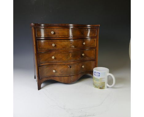 An Edwardian miniature serpentine-front Chest of Drawers, with decorative inlay and ivory handles, W 37 cm x H 33 cm x D 20 c