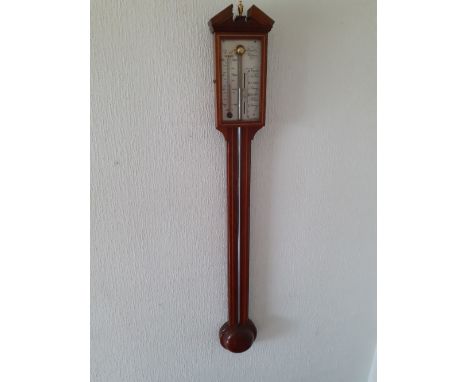 A modern reproduction stick barometer by Comitti Holborn having an oak and mahogany case.39" high 100/200