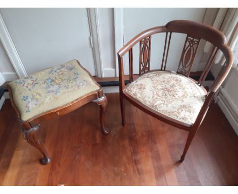 An Edwardian mahogany Elbow Chair with padded seat together with a queen anne style dressing table stool with tapestry seat. 