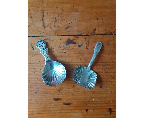 A Georgian Silver Caddy Spoon with embossed and chased decoration TM Birmingham 1795/6 together with a later caddy spoon with