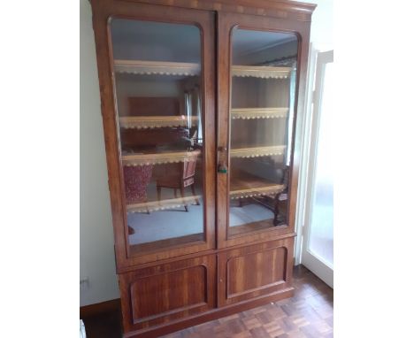 Early Victorian Walnut Veneer two glass door bookcase with tooled leather shelf fronts the base having two cupboards.63" W x 