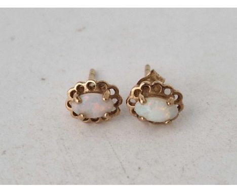 A pair of opal ear studs 9ct