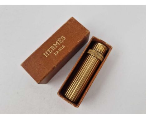 A RARE HERMES OF PARIS GILT LIPSTICK STYLE LIGHTER IN ORIGINAL BOX