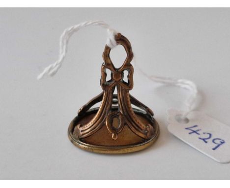 A antique fob seal set with agate intaglio carved with a warriors head