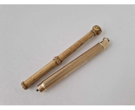 TWO ENGINE TURNED PENCILS 9CT