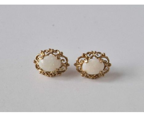 A pair of ornate opal stud earrings 9ct 1.5 gms
