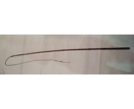 A trap/coaching whip, principally in polished thorn wood, of tapering cylindrical form with a stitched tan leather handle, se
