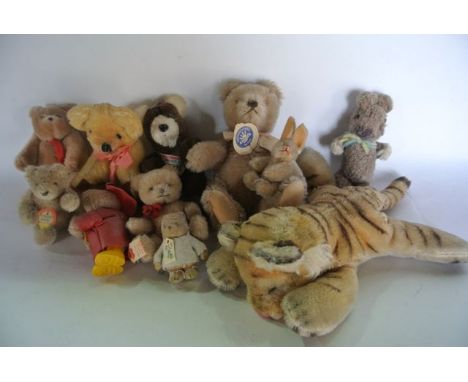 A large selection of vintage teddy bears to include a miniature seated bear with a Steiff Original Teddy label, a further lar