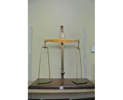 A set of balance scales to weight 7lb capacity by W & T Avery of Birmingham with excise stamps from 1896 to 1964