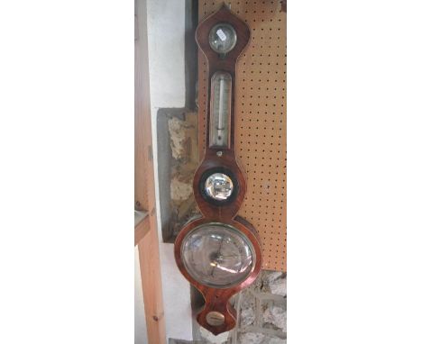 A 19th century mahogany wheel barometer, the case with box wood and ebony string inlay with silvered dials set beneath an oni