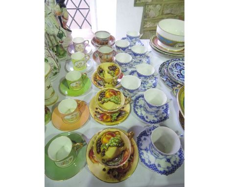 A collection of Copenhagen blue and white tea wares with stylised floral and scale decoration comprising eight cups and six s