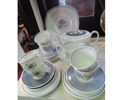 A six place Susie Cooper tea set in the Glen Mist pattern C1035 comprising teapot of oval form, milk jug, sugar bowl, six cup