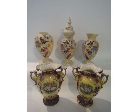 A pair of Victorian opaque glass vases of baluster form, raised on circular bases with ivory coloured ground and hand painted