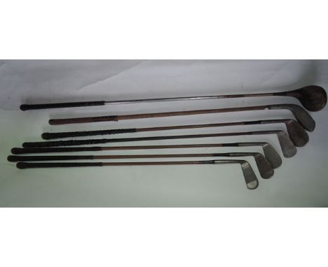 A selection of eight vintage golf clubs with examples stamped Scotia Iron, Made in Scotland R Forgan & Son, St Andrews, furth
